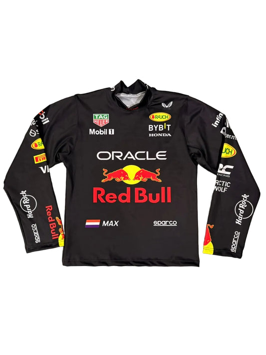 A black Oracle Red Bull Racing long-sleeve performance jersey laid flat on a gray tiled floor. The jersey features the prominent red Bull logo in the center, with sponsor logos such as TAG Heuer, Mobil 1, Bybit, and Honda, and player name MAX printed on the front.