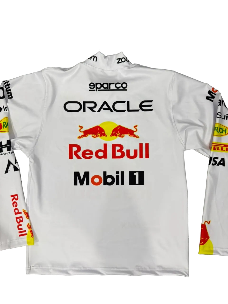 A white Oracle Red Bull Racing long-sleeve jersey laid flat on a gray marble-patterned floor, featuring sponsor logos including Sparco, Oracle, Red Bull, Mobil 1, Pirelli, and Castore.